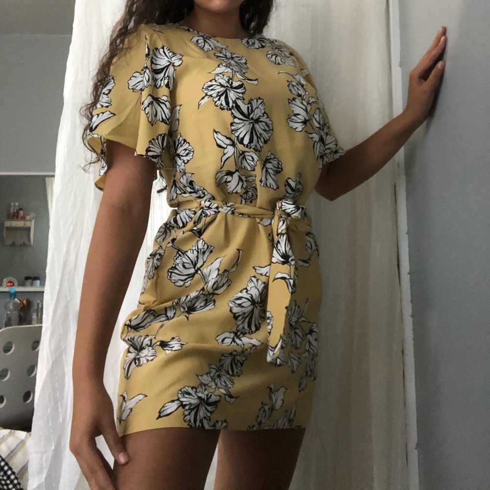 Super cute yellow mini dress with flower designs